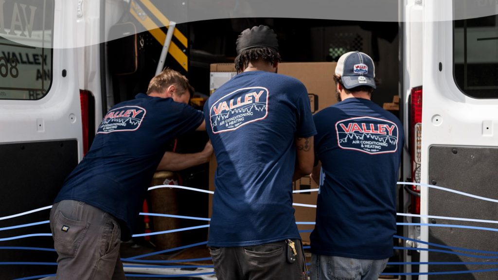 Valley Air HVAC techs unloading a new HVAC system.
