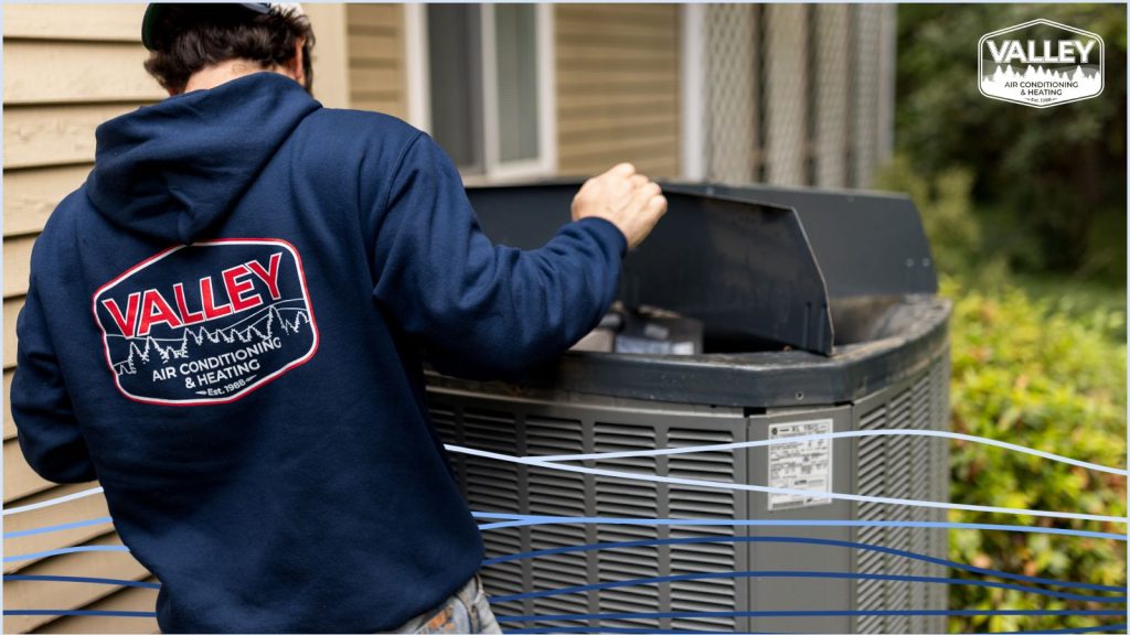 A Valley Air tech working on a heat pump.