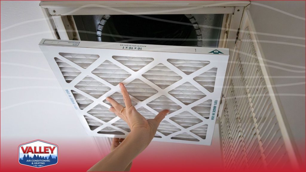 A person changing an air filter
