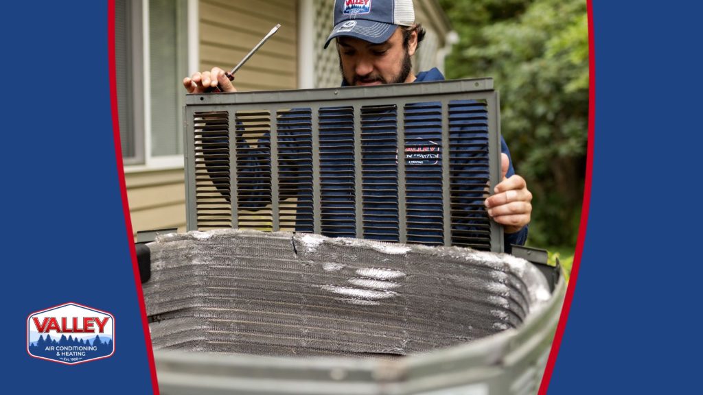 An HVAC tech servicing a AC unit.