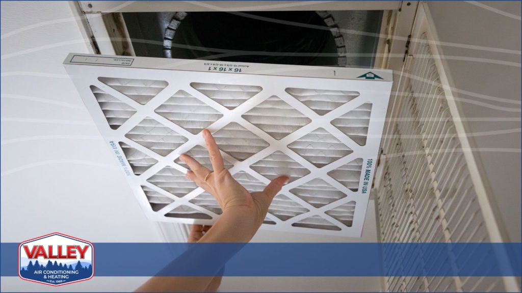 A Valley Air tech working on changing a air filter.